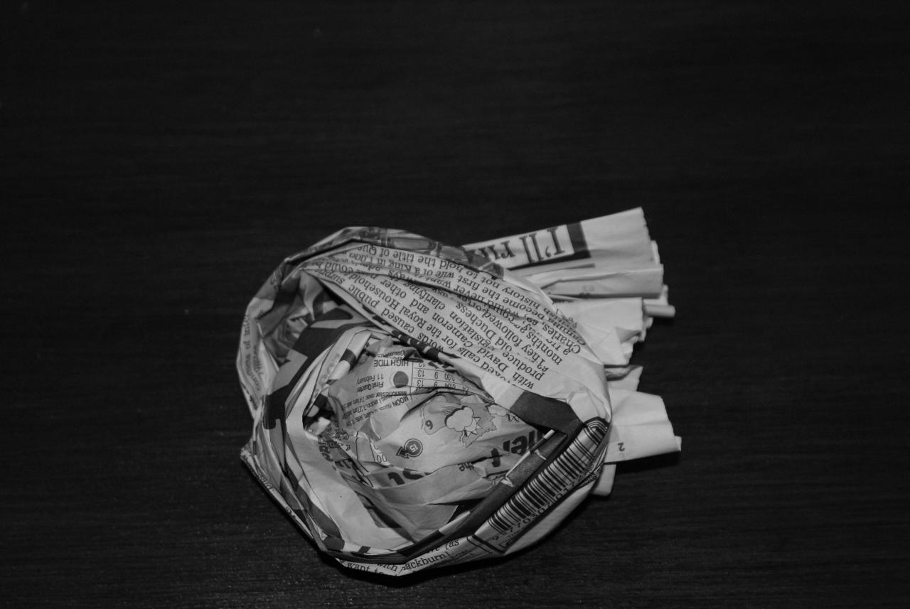 Sheet of newspaper tucked into a firm ball