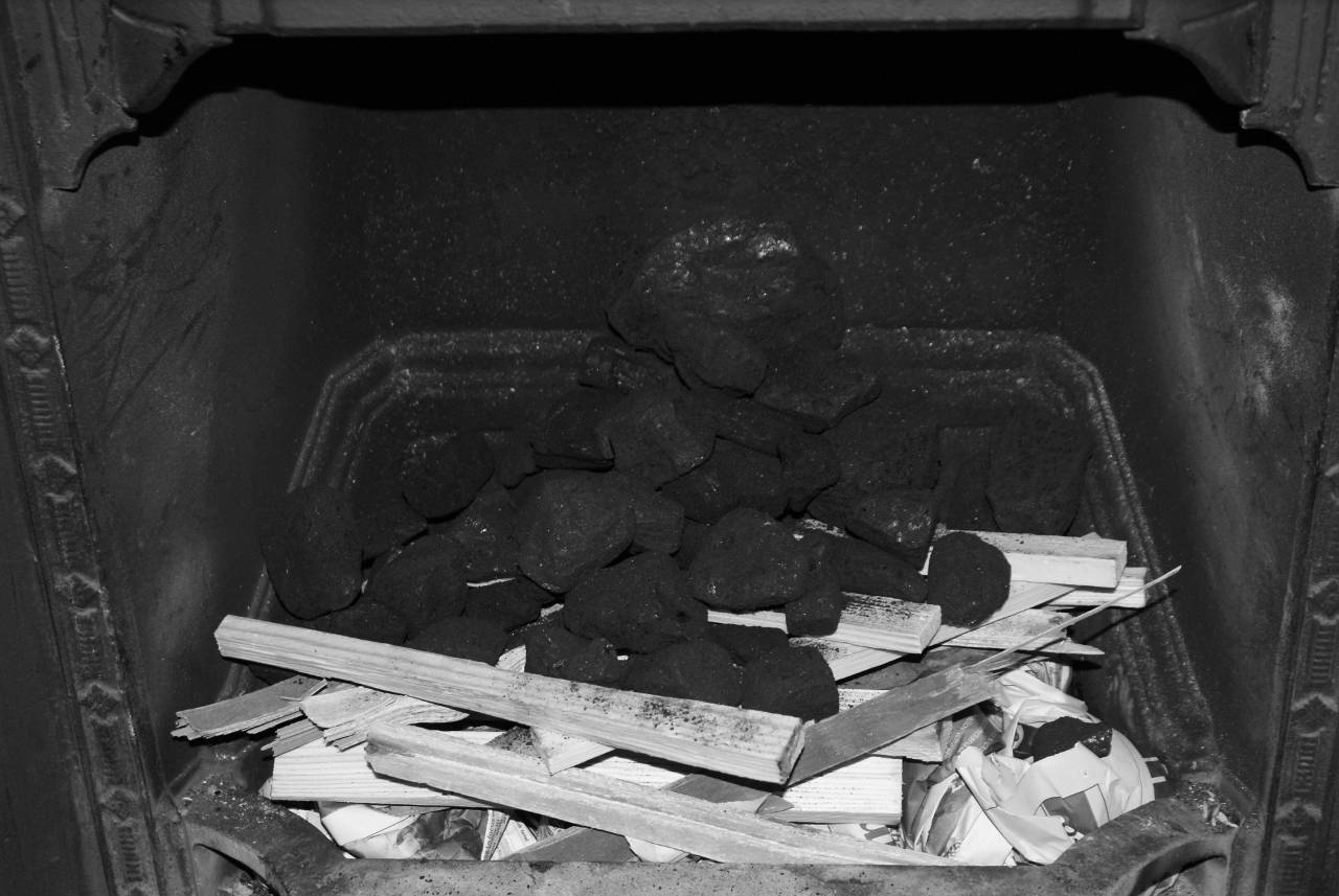 Layer of coal on wood kindling for fire